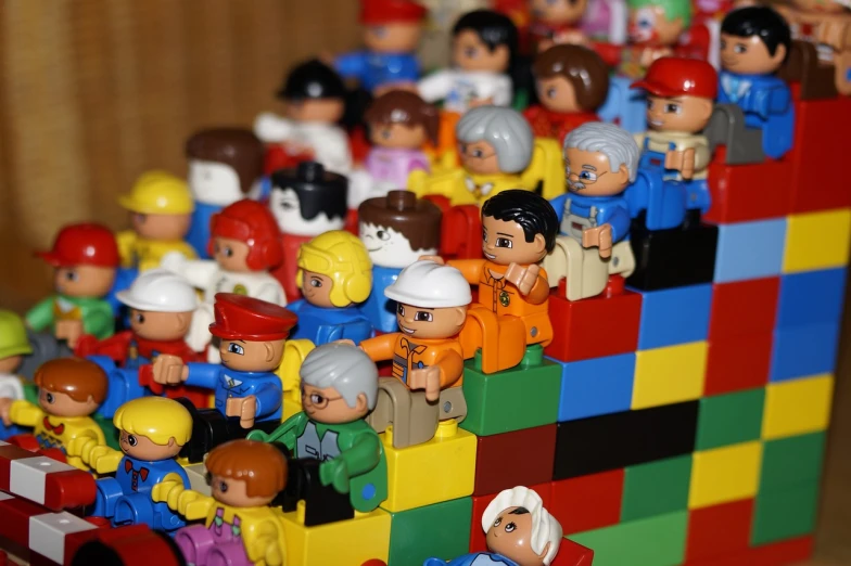 a bunch of toys sitting on top of a table, a picture, by Adam Manyoki, flickr, constructivism, crowd of people, brick, [ closeup ]!!, miyamoto abduzeedo