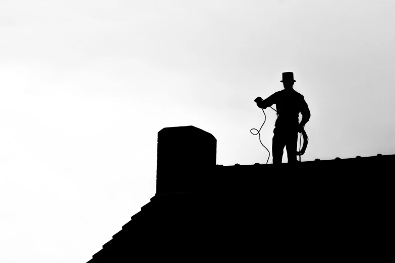 a man that is standing on top of a roof, by Matthias Weischer, shutterstock, minimalism, hoses, wearing a tophat, b&w hasselblatt, silhoutte