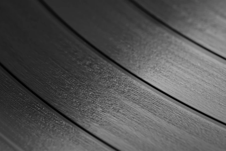 a black and white photo of a vinyl record, a black and white photo, by Thomas Häfner, unsplash, bauhaus, detailed wood, closeup 4k, smooth panelling, high resolution product photo