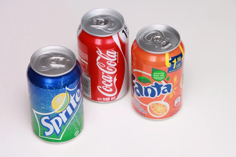a group of soda cans sitting next to each other, a picture, flickr, photostock, frank frazeta, candies, 3 colors