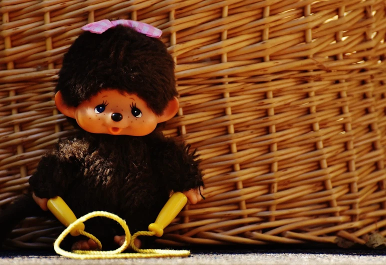 a close up of a stuffed animal with a banana peel, a picture, flickr, lowbrow, cheburashka, wicker chair, brunette, beautiful sunny day