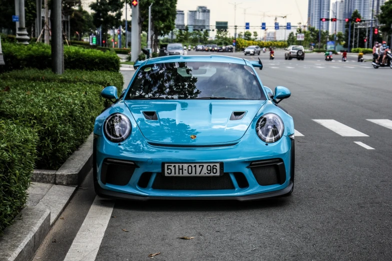 a blue car parked on the side of the road, by Reuben Tam, pexels contest winner, happening, porsche rsr, avatar image, shanghai, cute:2
