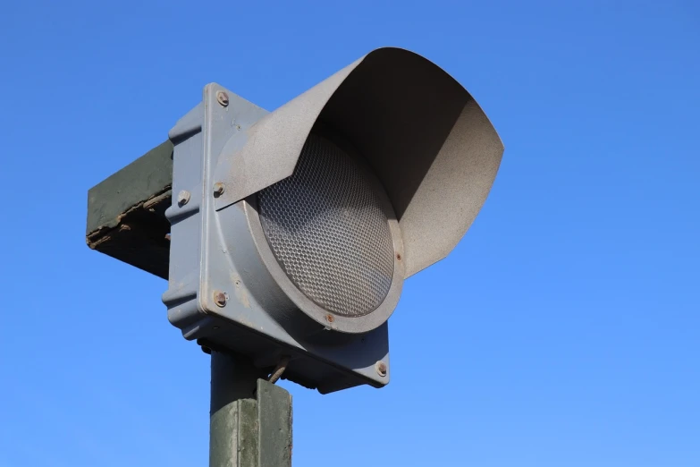 a close up of a traffic light on a pole, front left speaker, 200mm, professional quality, front light