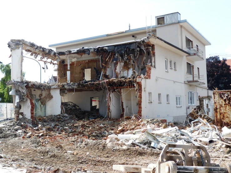a building with a pile of rubble in front of it, flickr, shin hanga, huge smashed mansion, biroremediation, cut, ( ready - made )