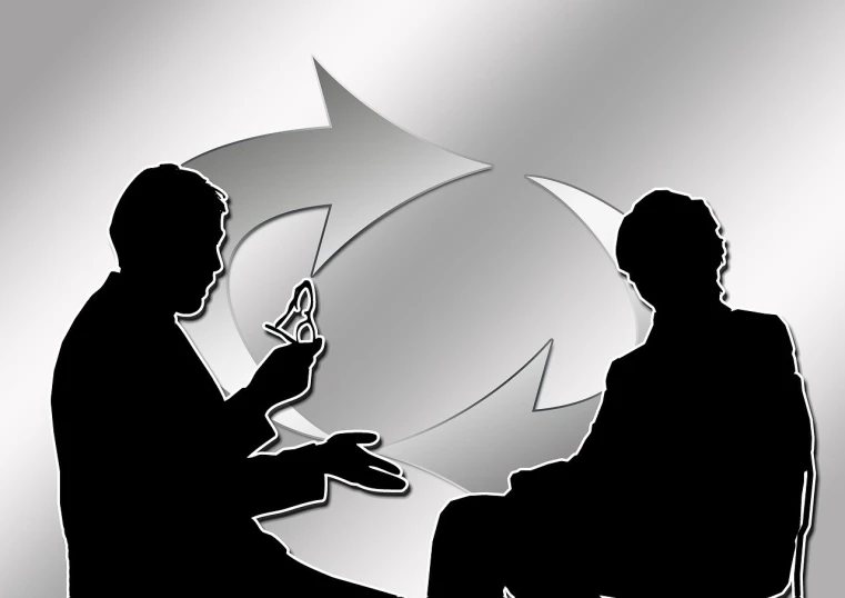 a couple of men sitting next to each other, a picture, by Allen Jones, pixabay, precisionism, with pointing finger, business meeting, feedback loop, metal