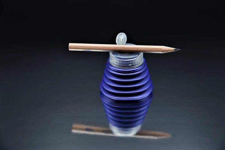 a blue vase with a pencil sticking out of it, by Juan O'Gorman, featured on zbrush central, op art, miniature product photo, carved from sapphire stone, orrery, shot on a 9.8mm wide angle lens