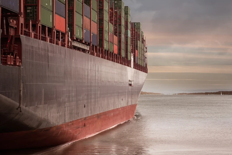 a large cargo ship sitting on top of a body of water, shutterstock, figuration libre, dynamic closeup, full frame shot, shipping containers, cinematic shot!