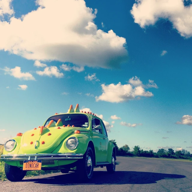 a green car with surfboards on top of it, a photo, by Matthias Weischer, flickr, pop art, stag beetle, car on highway, on a bright day, woodstock