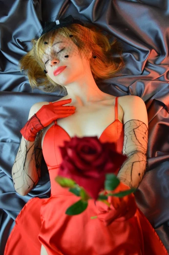 a woman in a red dress holding a rose, a portrait, inspired by Delphin Enjolras, tumblr, romanticism, asuka suit under clothes!, cosplayer dressed like a crab, glamorous jill valentine, above view