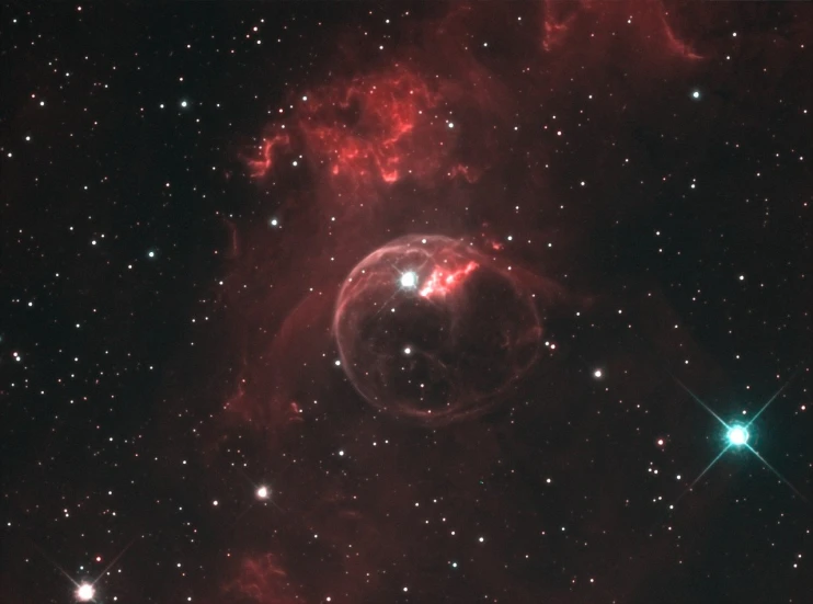 a large bubble in the middle of a cluster of stars, by Roy Newell, glowing red skull, award winning shot, ethereal lighting - h 640, truncated snout under visor