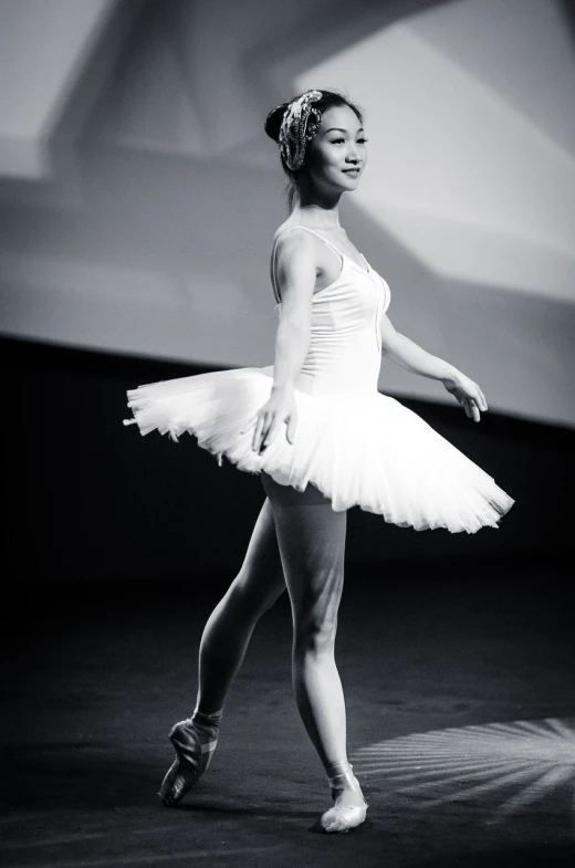 a black and white photo of a woman in a tutu, a black and white photo, by Ruth Jên, arabesque, grand finale, an all white human, gongbi, 2012