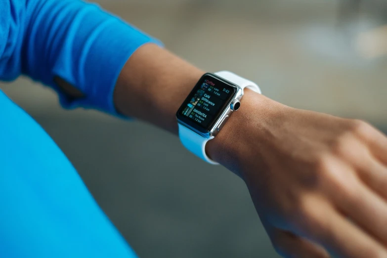 a close up of a person wearing an apple watch, a picture, happening, blue neon details, wearing fitness gear, digital media, square