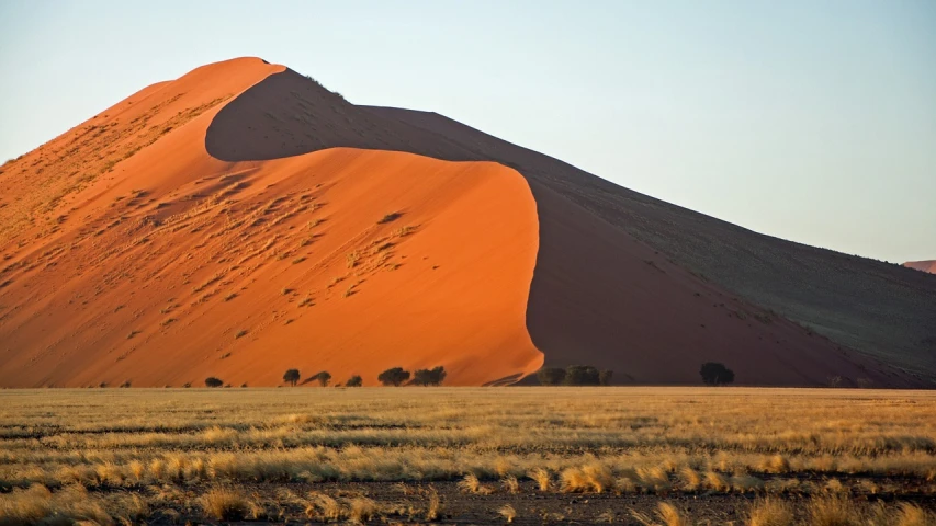 a large sand dune in the middle of a desert, a picture, by Peter Churcher, fine art, evening light, red hues, july 2 0 1 1, buffalo