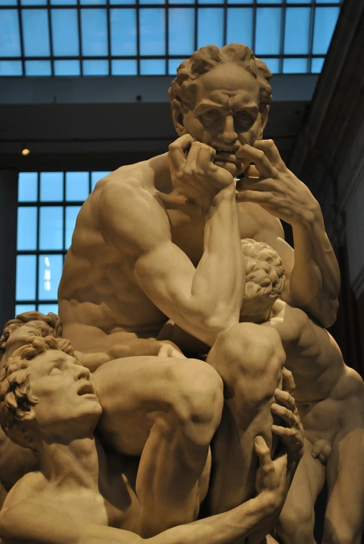 a statue of a man sitting on top of a pile of people, a marble sculpture, by Michelangelo, flickr, intense emotion, muscular bodies, 3 heads, art »