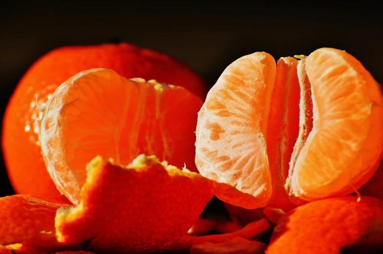 a close up of a peeled orange on a table, a macro photograph, pexels, digital art, orange slices, orange lamp, 3 4 5 3 1, fruits
