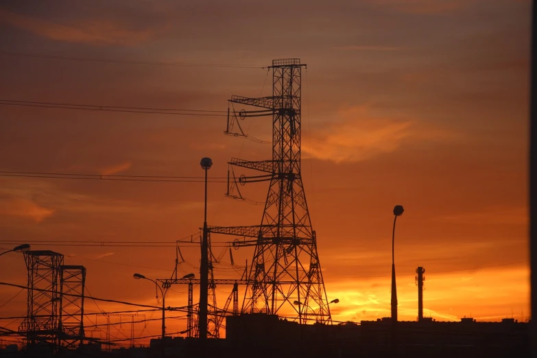 a group of power lines with a sunset in the background, by Andrei Kolkoutine, flickr, moscow, stock photo