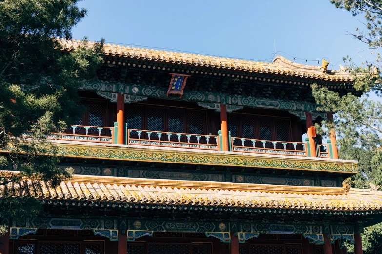 a tall building with a clock on top of it, an ultrafine detailed painting, inspired by Zhang Zongcang, shutterstock, cloisonnism, in balcony of palace, photo taken on fujifilm superia, beautiful sunny day, the imperial palace