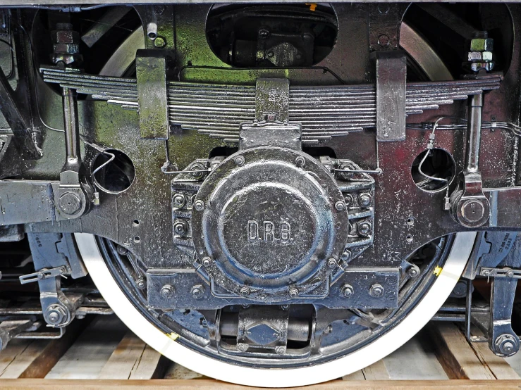 a close up of a train wheel on a track, dau-al-set, highly detailed image, front portrait, dlsr photo, big engine