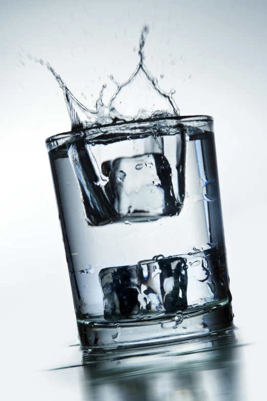 a glass of water with ice cubes in it, a picture, by Jan Rustem, shutterstock, water running down the walls, high detail product photo, partly underwater, oh yeah