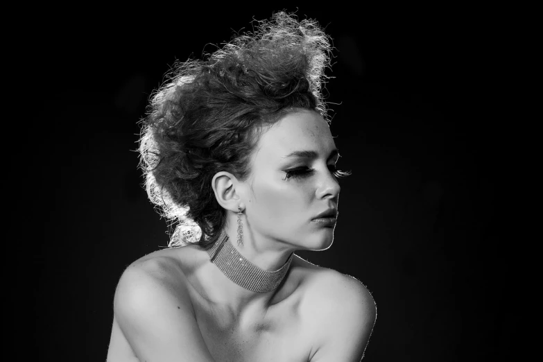 a black and white photo of a woman, a black and white photo, inspired by Peter Basch, 8 0's hairstyle, curly messy high bun hairstyle, dramatic lighting))), jewelry photography
