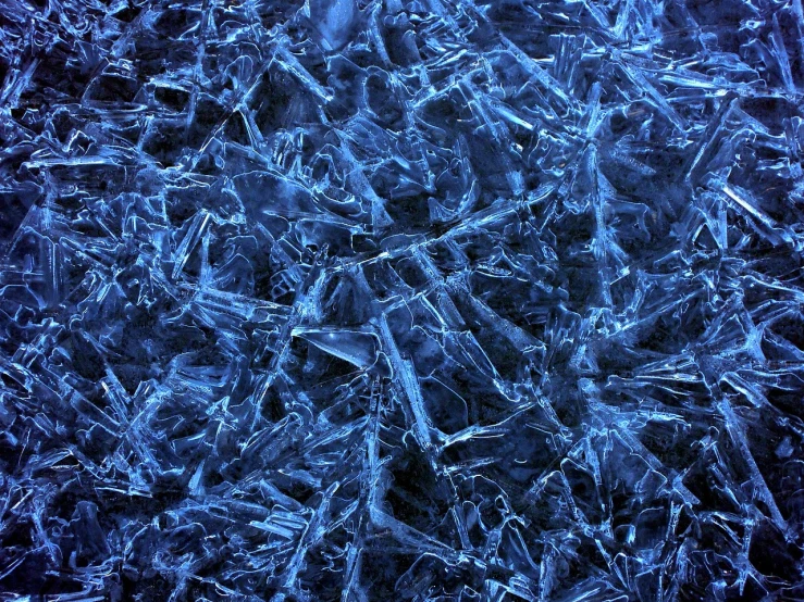 a close up of a bunch of ice crystals, inspired by Arthur Burdett Frost, wallpaper”, dark background ”, grain”