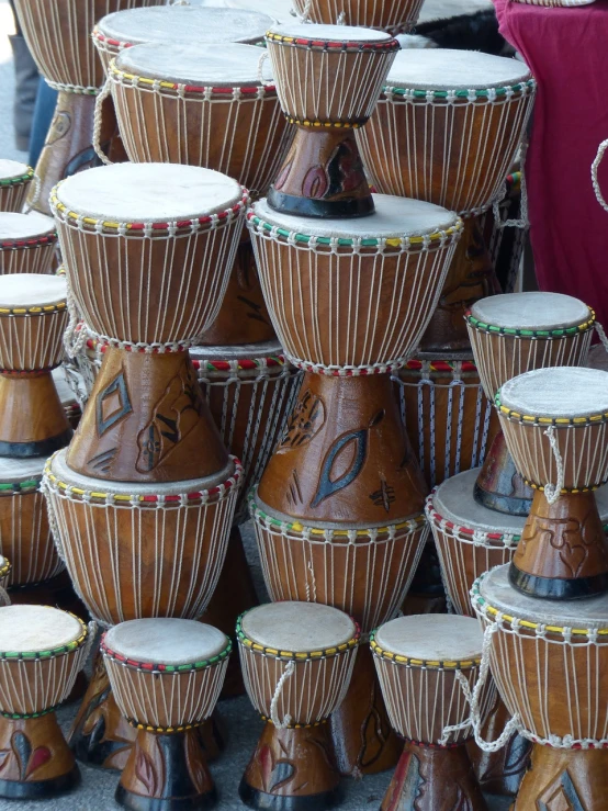 a group of drums sitting on top of each other, a picture, shutterstock, hurufiyya, edward buba, hand made, symmetry!!!, stock photo