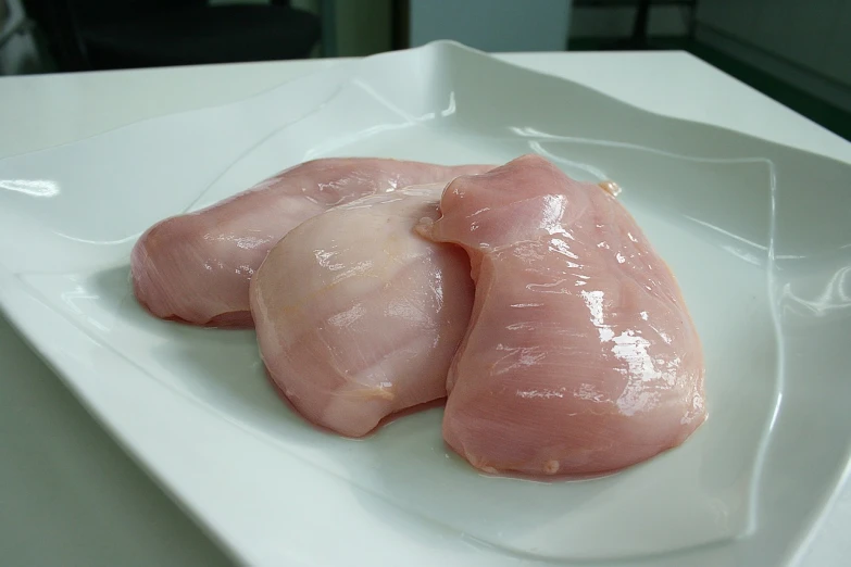 three pieces of raw chicken on a white plate, a picture, by Josetsu, flickr, fleshy musculature, pale!, bald lines, beutiful!