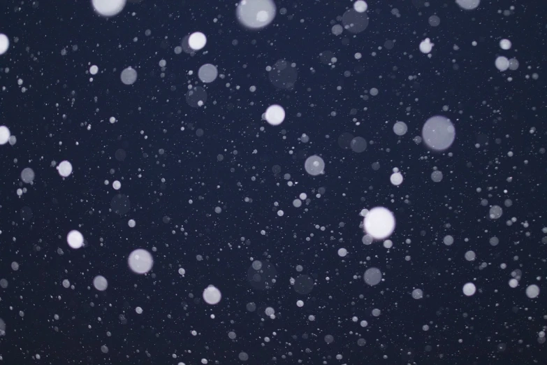 a man riding a snowboard down a snow covered slope, inspired by Vija Celmins, unsplash, pointillism, dark wallpaper, background image, wallpaper - 1 0 2 4, moonlight snowing