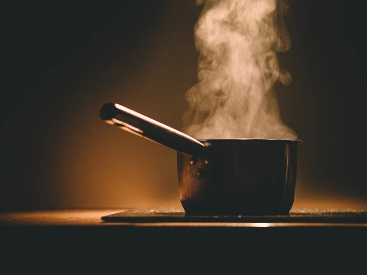 a pot with steam rising out of it, a stock photo, by Matt Cavotta, dark kitchen of an art student, a wooden, slightly pixelated, stainless steal