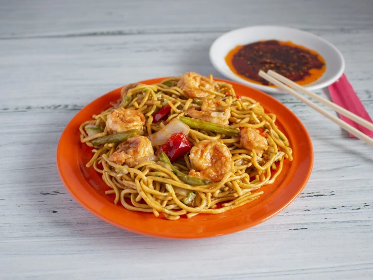 a close up of a plate of food with chopsticks, shutterstock, served with pasta, high quality product photo, shrimp, miniature product photo