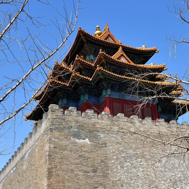 a tall tower with a clock on top of it, inspired by Wen Zhengming, flickr, cloisonnism, the forbidden city, wall wood fortress, stone roof, in sunny weather