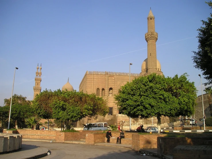 a couple of people that are standing in front of a building, by Ahmed Yacoubi, flickr, hurufiyya, minarets, egyptian, berkerk, plaza