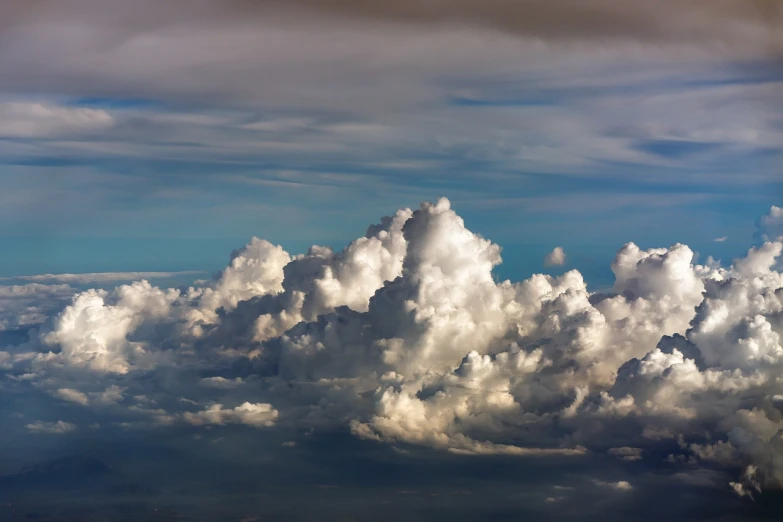 a blue sky filled with lots of white clouds, by Jan Rustem, romanticism, airborne view, dramatic storm clouds, dramatic warm morning light, cloud palace