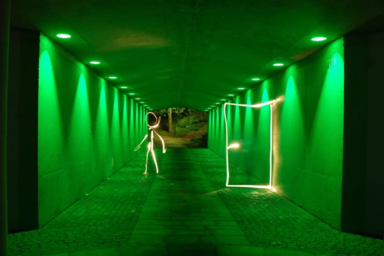 a man that is standing in the middle of a tunnel, inspired by Johann Kaspar Füssli, street art, green concert light, stick figure, robot photography, green square