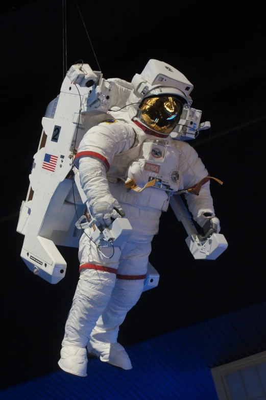 a close up of a person in a space suit, inspired by Alan Bean, pexels, wearing jetpack, on display in a museum, [ realistic photo ]!!, extreamly detailed