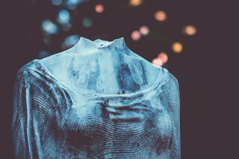 a shirt on a mannequin mannequin mannequin mannequin mannequin mannequin mannequin mannequin, a marble sculpture, inspired by Elsa Bleda, unsplash, frozen and covered in ice, photo taken at night, covered with liquid tar. dslr, bokeh”