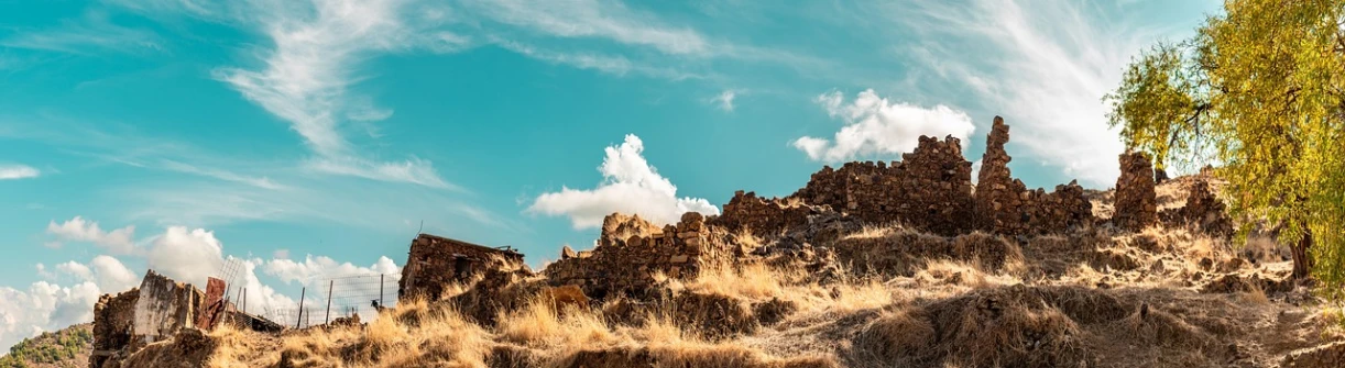 a very tall castle sitting on top of a hill, unsplash, romanticism, in the dry rock desert, background image, “puffy cloudscape, half image