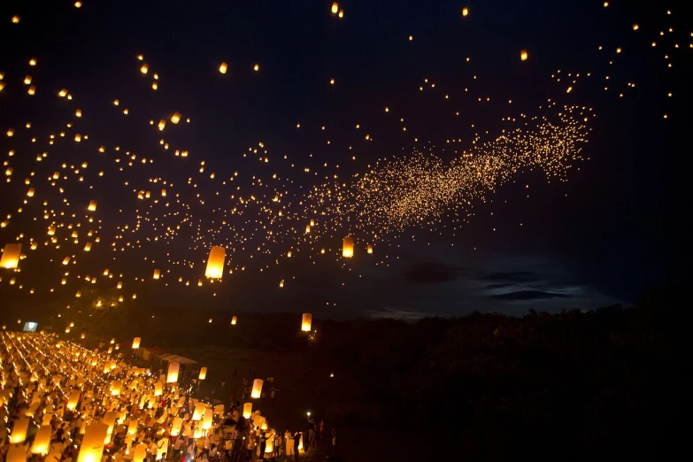 a bunch of lanterns that are flying in the sky, by Etienne Delessert, tumblr, happening, mexico, scotland, laos, torches