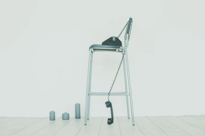 a chair sitting on top of a hard wood floor, by Jan Kupecký, postminimalism, telephone, empty stools, daily render, a tall