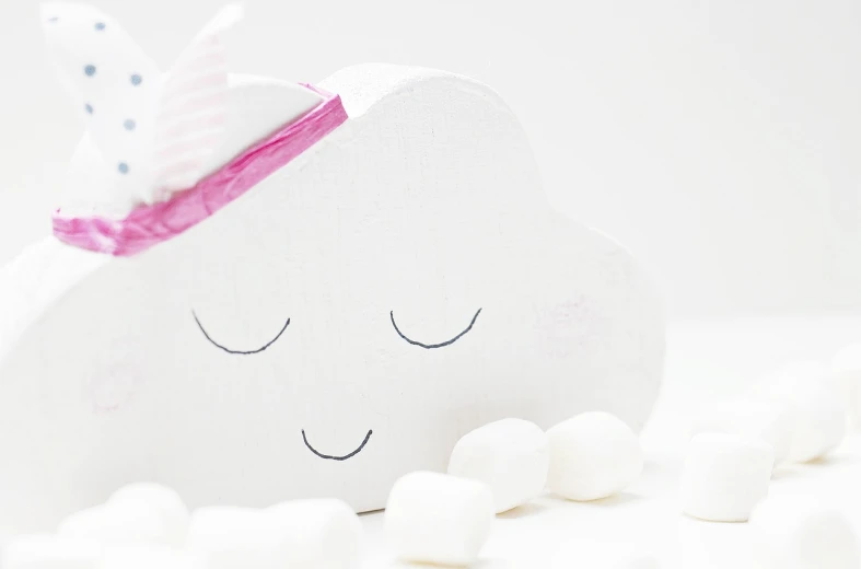 a white cloud sitting on top of a pile of marshmallows, by Zsuzsa Máthé, sweet smile, diy, dreamcore, makeup