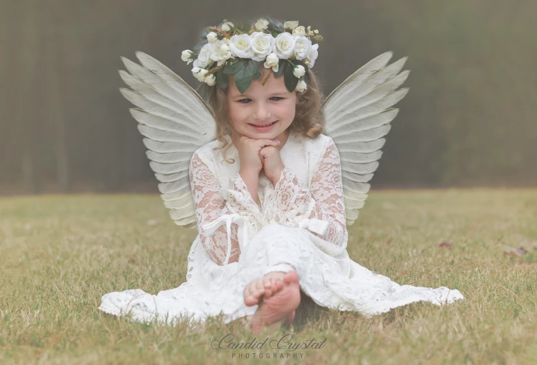 a little girl that is sitting in the grass, a portrait, inspired by Ida Rentoul Outhwaite, bladed wings lace wear, wearing angel halo, contest winner 2021, award winning photograph!