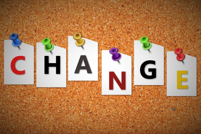 a cork board with the word change written on it, by Helen Thomas Dranga, trending on pixabay, happening, things hanging from ceiling, 4 k manga wallpaper, profile pic, two hang