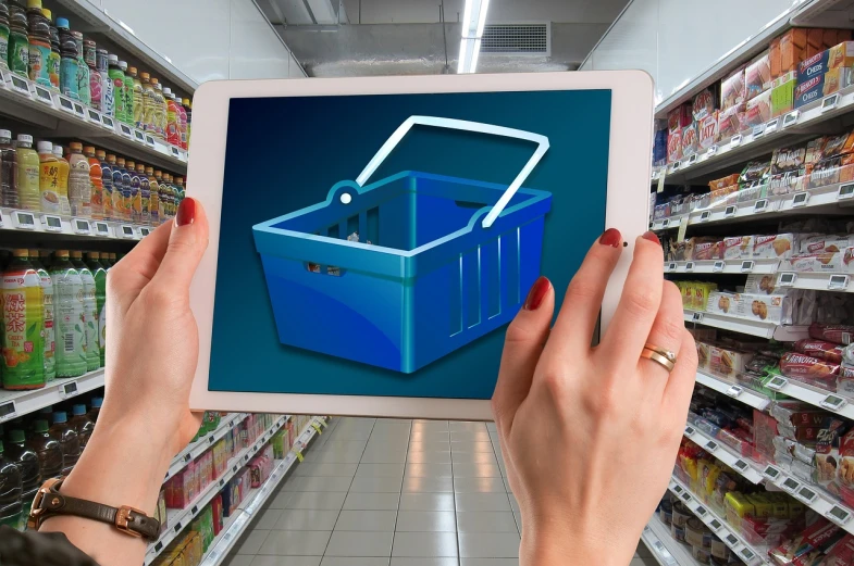 a person holding a tablet with a shopping basket on it, shutterstock, packshot, digital reality, shelf, blue - print