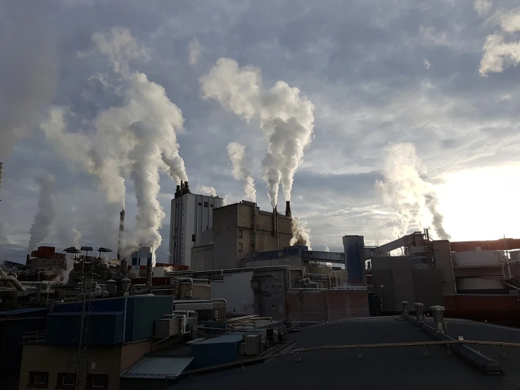 a factory with a lot of smoke coming out of it, a picture, 8k octan photo, bc, walking to work, high technology inplants