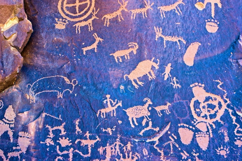 a close up of a rock with a painting on it, a cave painting, by Leonard Bahr, fine art, purple ancient antler deity, camels, mobile wallpaper, blue - print