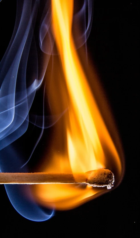 a close up of a lit match on a black background, a picture, by Jan Rustem, unsplash, fine art, avatar image, on blue fire, scientific photo, 4k vertical wallpaper