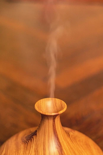 a wooden vase with steam rising out of it, a stock photo, purism, medium close-up shot, close-up product photo, smoke under the ceiling, upper body close - up