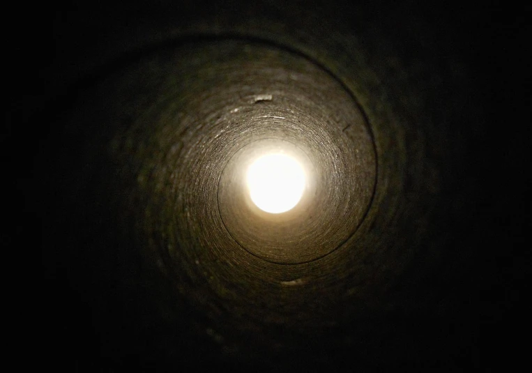 a picture of a light at the end of a tunnel, a picture, by Joe Stefanelli, flickr, water pipe, high angle close up shot, moonlight shafts, worm hole