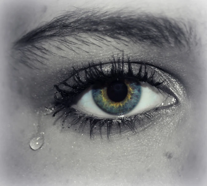 a close up of a person's eye with a tear coming out of it, a photo, heartbroken, blank stare”