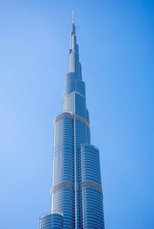 the burjra is the tallest building in the world, pexels contest winner, high key detailed, beautiful sunny day, short telephoto, clear blue skies